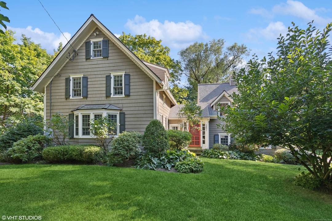 This charming Antique Colonial is set on a serene park like acre in the heart of West Norwalk.