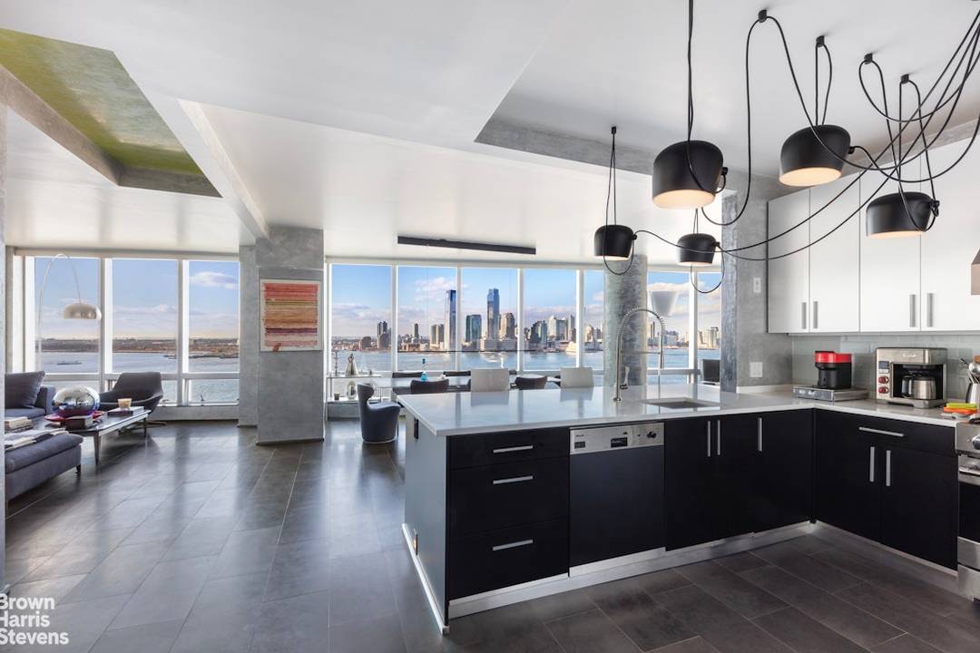 Welcome to Residence 17A at 10 Little West Street, a stunning completely renovated, custom designed 2 3 bedroom apartment.