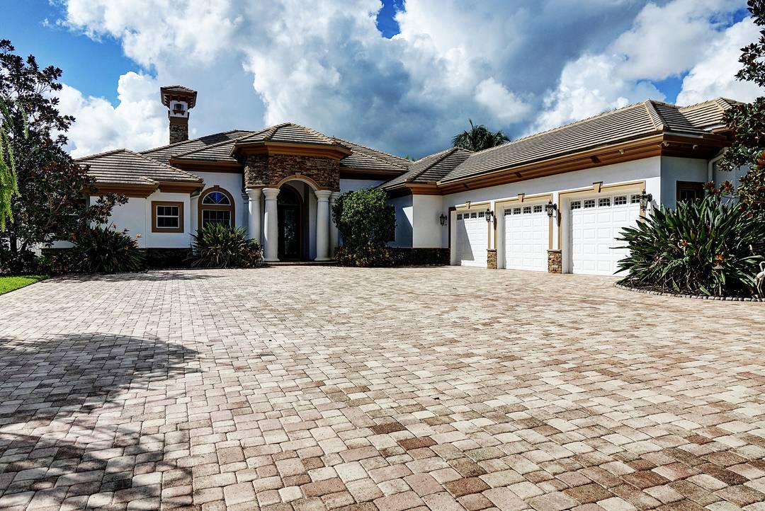 Luxury living on the St Lucie River in this one story custom 2016 gated estate on 1 acre at end of private cul de sac.