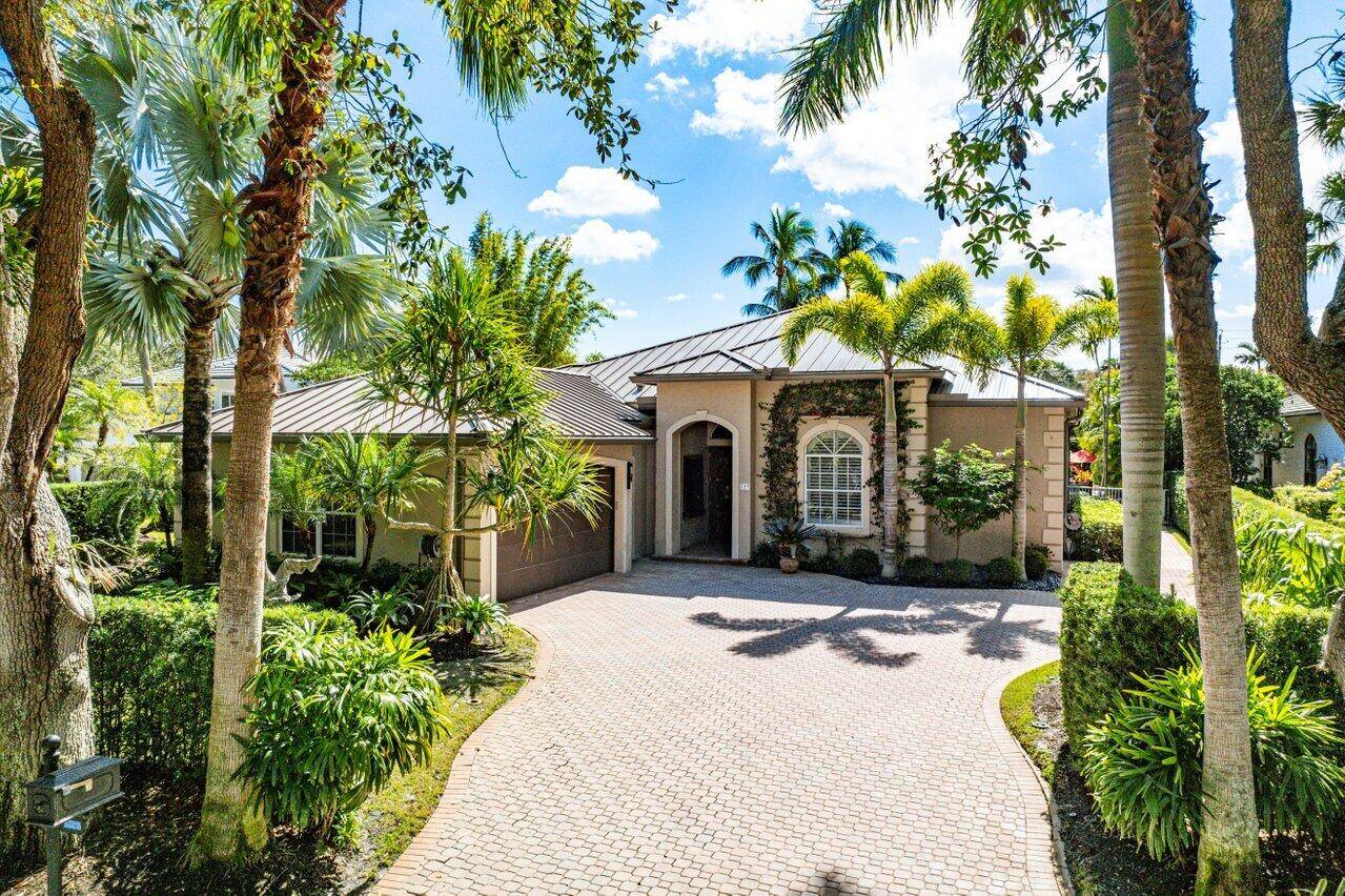 One's entry through the front foyer into the living room is immediately greeted by breathtaking views of the beautifully expansive backyard, creating a seamless connection between indoor and outdoor living.