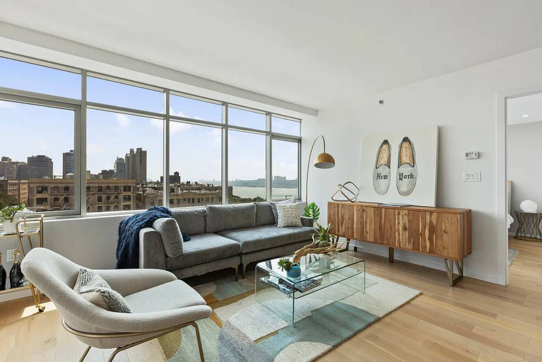 This gorgeous penthouse is a 2 bedroom 2 bathroom home featuring floor to ceiling, triple paned windows, private balcony and sweeping views of the Hudson River.