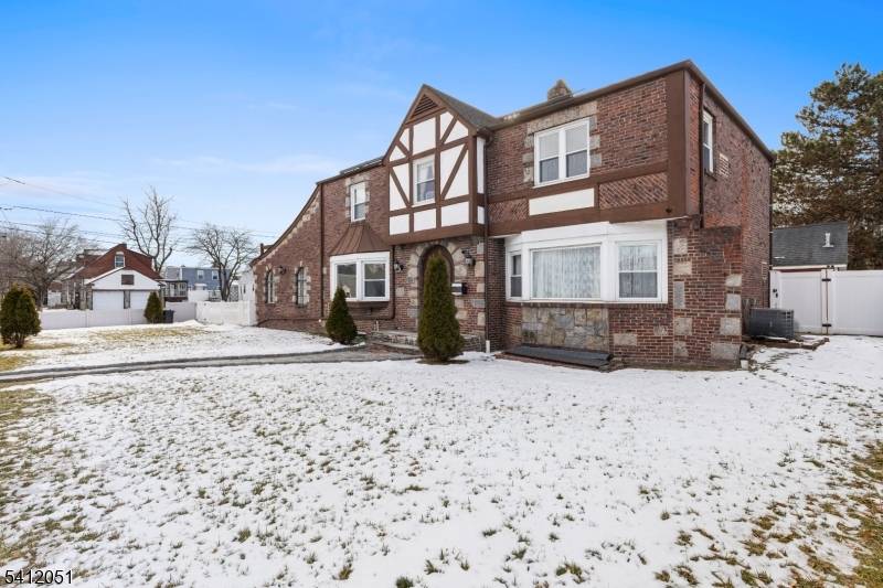 Stately 2, 679 sq. ft. Tudor style brick colonial offers exceptional space, character, and convenience in the heart of Elmwood Park, NJ just 14 miles from New York City and ...