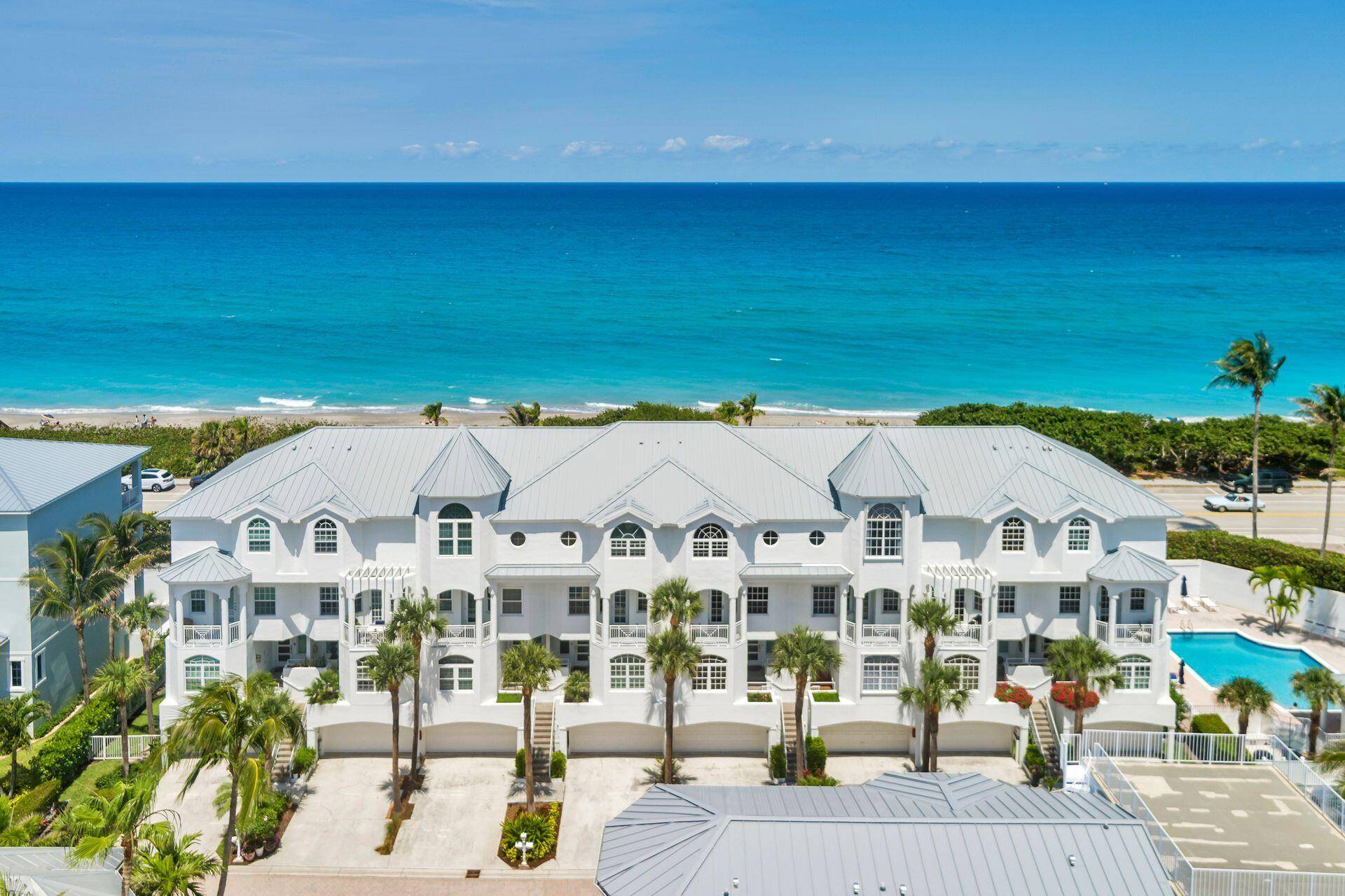 Enjoy panoramic beach and ocean views from this bright and spacious 4 bedroom, 4 bath townhouse in the exclusive, gated community of Jupiter Key.