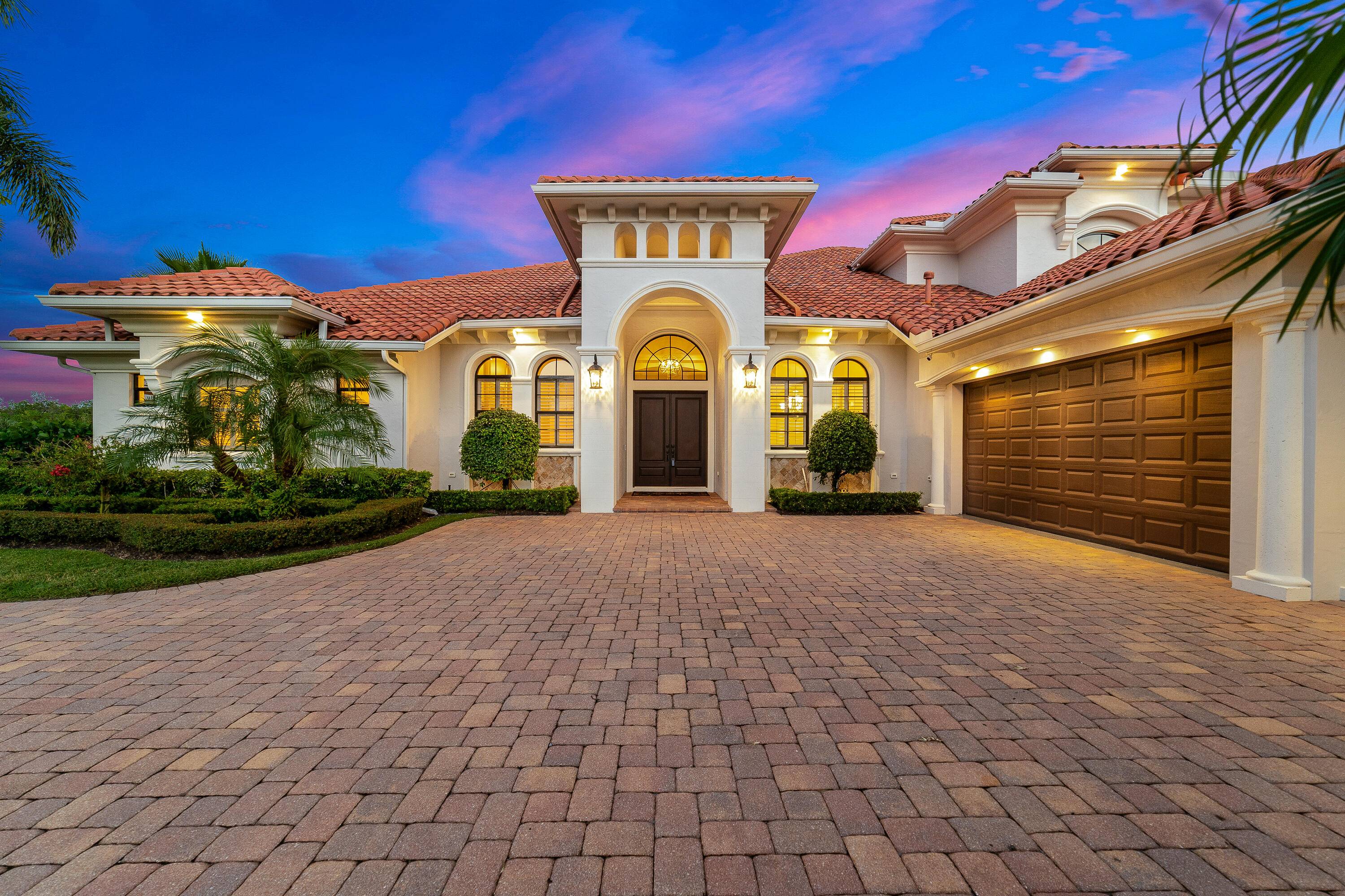 Welcome home to this exquisite 5 bedroom, 5 bath luxury estate located in the prestigious gated waterfront community of Ravello.