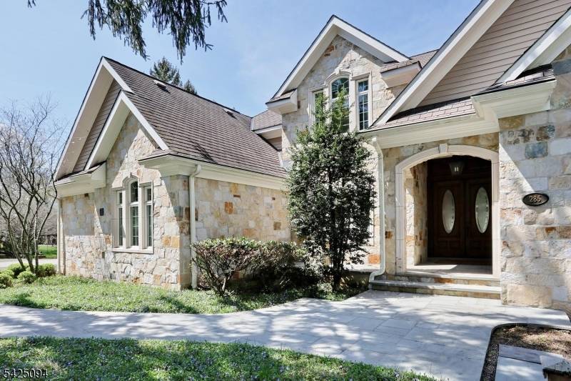 Breathtaking ! ! ! Dramatic Entry Foyer with Bridal Staircase, Living Room fireplace w French Doors to Stately Bluestone Patio, Banquet size Dining Room, Phenomenal Kitchen w High End Appliances, ...