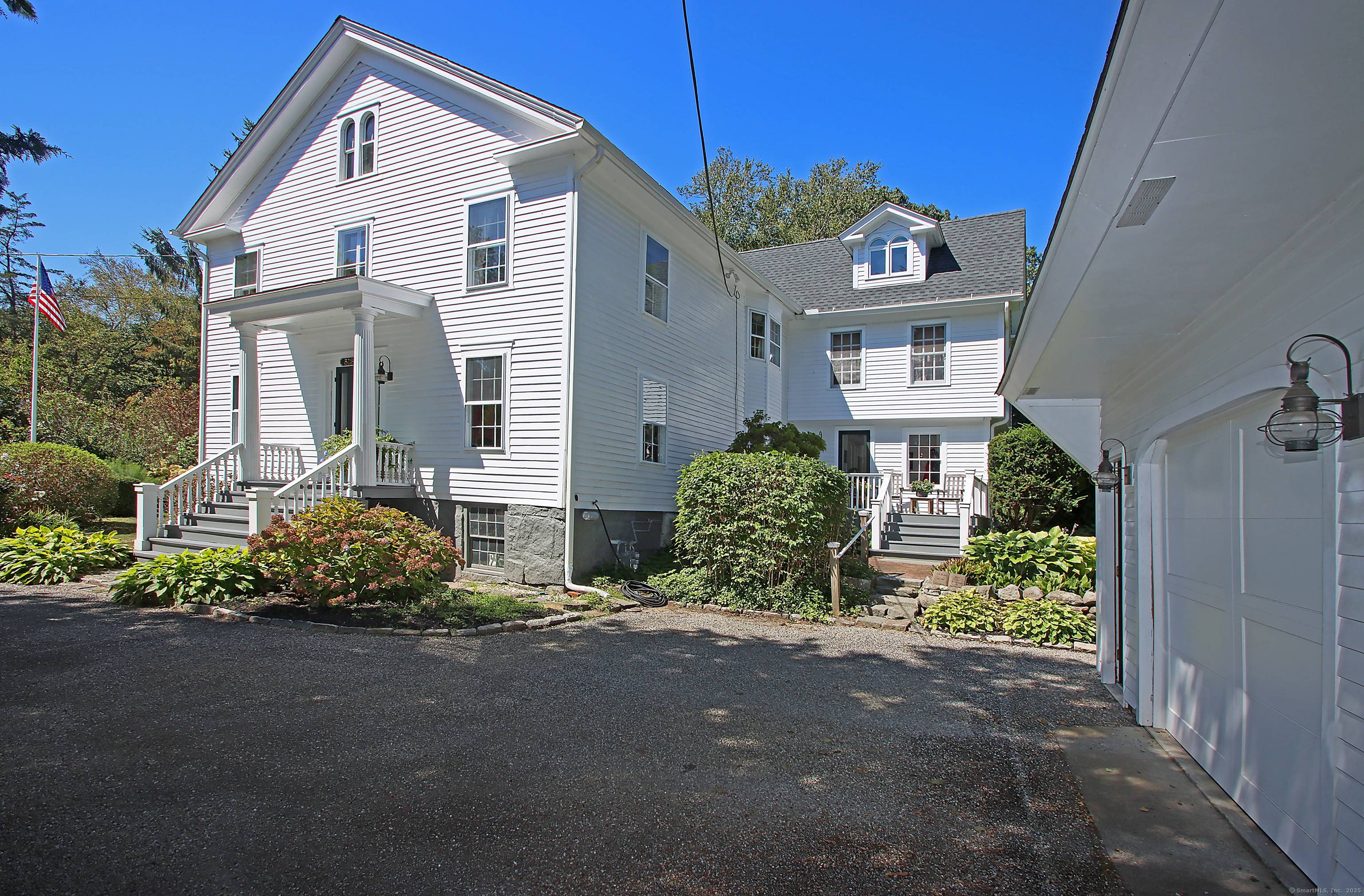Nestled in the heart of Madison Village, this exquisite Greek Revival style home offers unparalleled privacy.