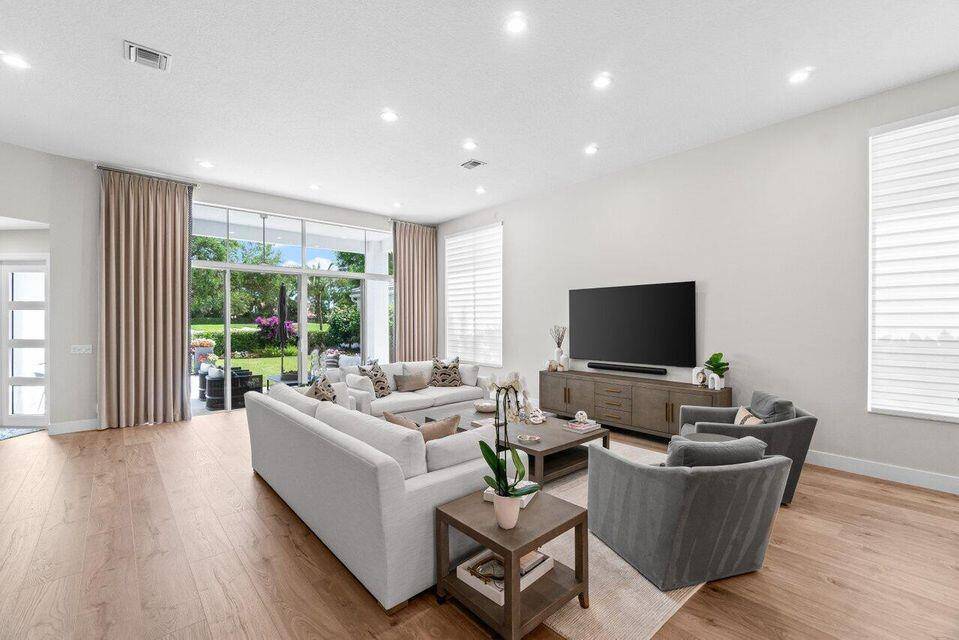 Experience resort style living in this stunning single story home, ideally located on a beautifully landscaped lot with sweeping panoramic golf course views.