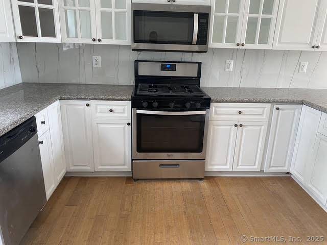 INVESTORS take notice, recently renovated tri level condo leased as separate units consisting of a 3 bed 2 bath and 3 studios 4 separate units.