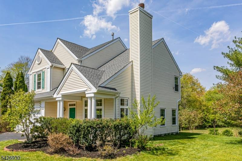 Just down the street from a vibrant park featuring tennis and basketball courts, a playground, and restrooms, this Woodsedge Bainbridge style home offers a spacious and detached lifestyle.