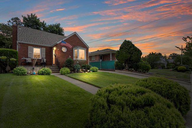 Pristine Cape Cod home featuring primary bedroom and full bath on main floor.