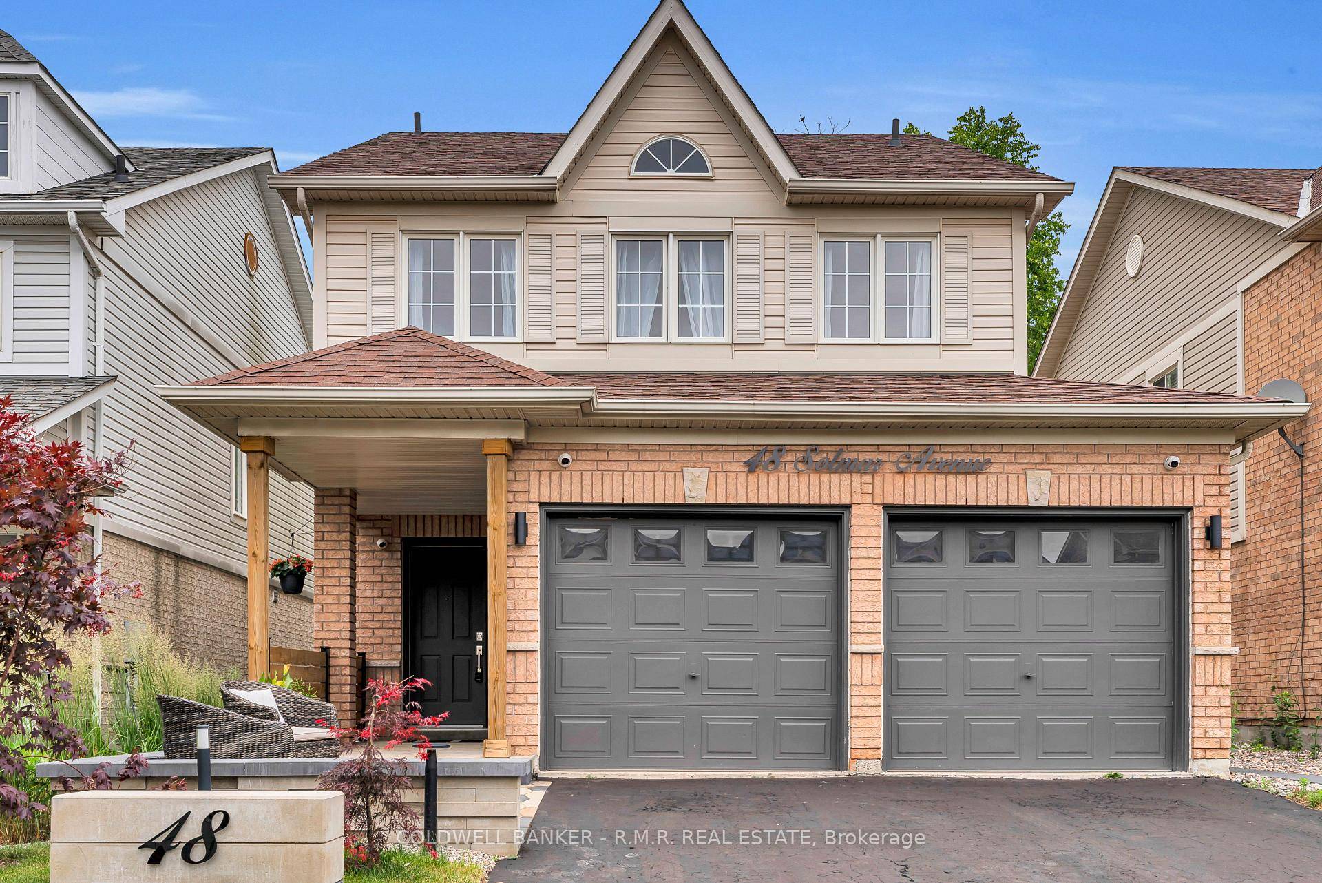 Welcome to 48 Solmar Ave in Whitby, a beautifully updated home backing onto peaceful greenspace with no rear neighbours.