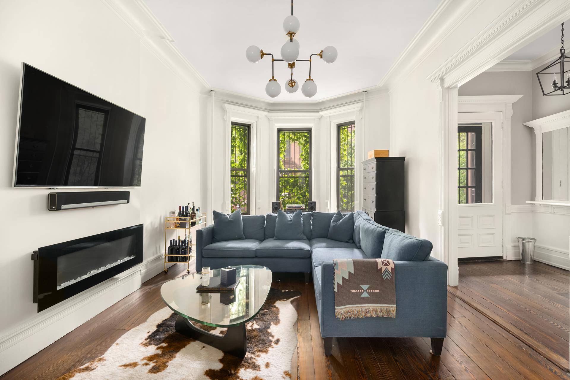 This lovely, South facing, 21 foot wide townhouse is located in the North Park Slope Historic District.