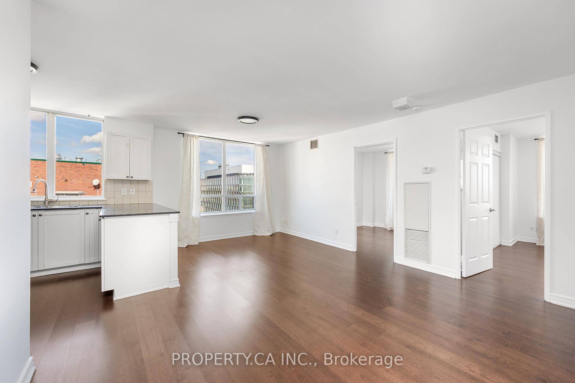 Spacious, sun filled NE corner suite with 2 bedrooms amp ; 2 baths, featuring hardwood floors, large windows, and a private balcony access from bedroom.