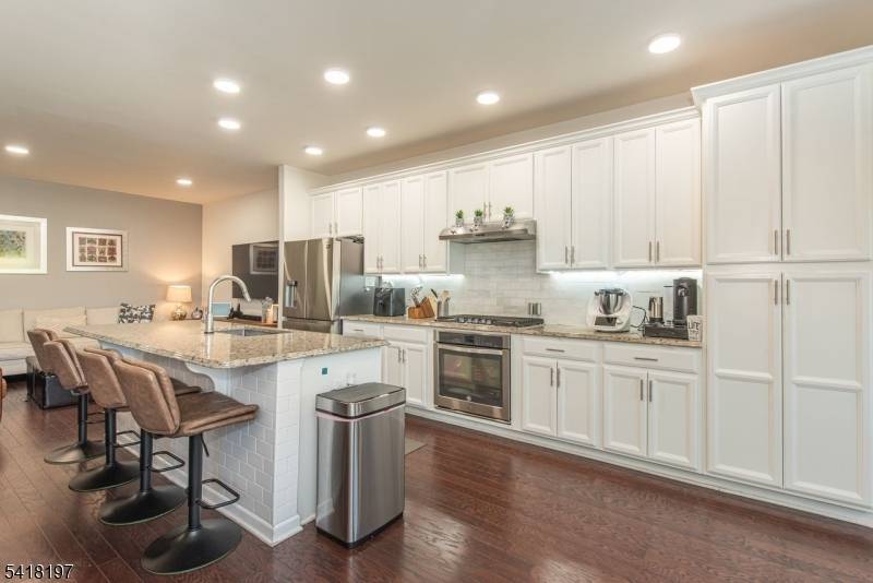 FIRST TIME OFFERED LUXURY LIVING AT IT'S BEST LOCATED IN DESIRABLE KENSINGTON SQUARE THIS CUSTOM.