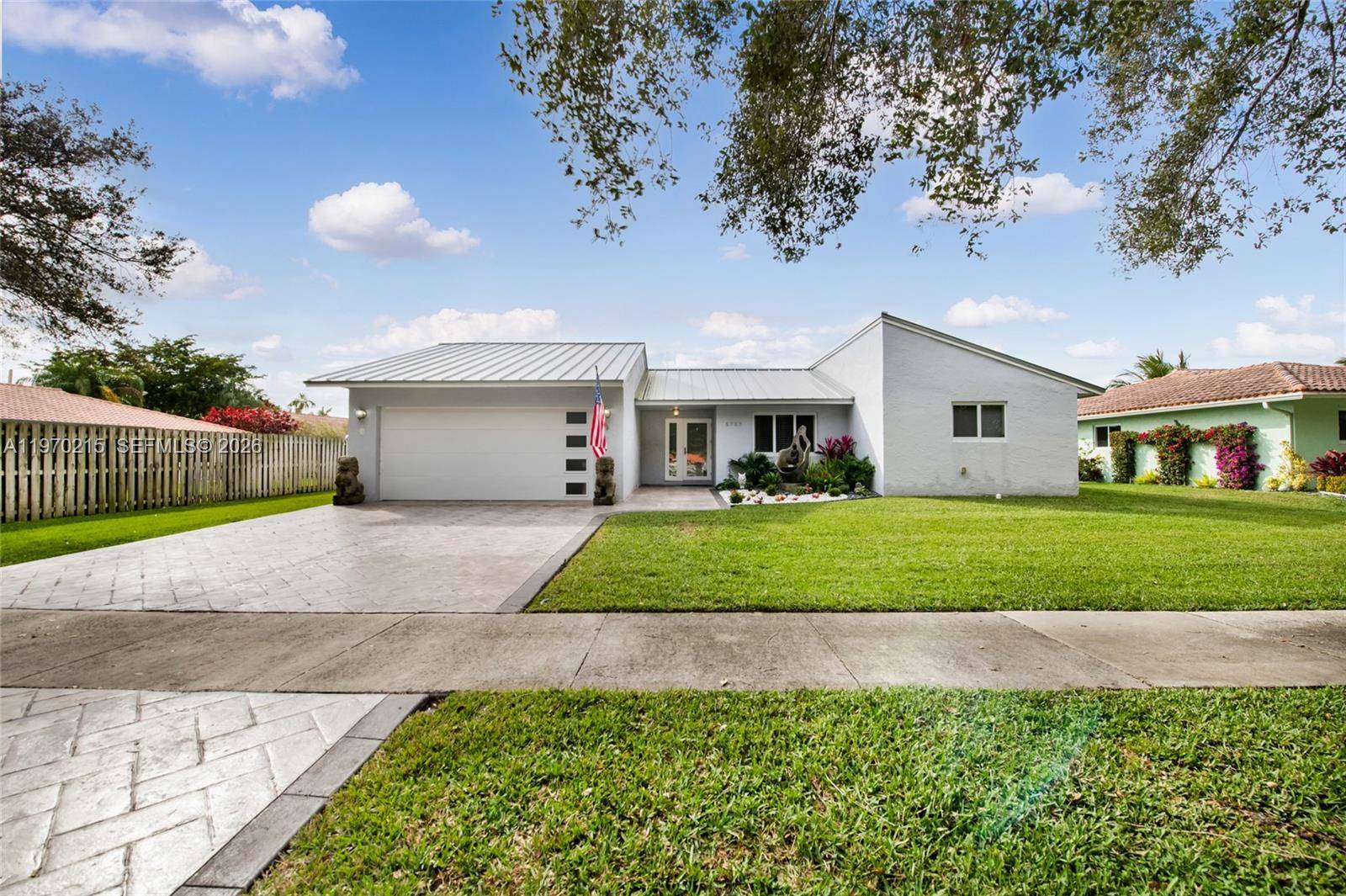 Welcome to this stunning lakefront home in the highly sought after Forest Lake community of Cooper City.