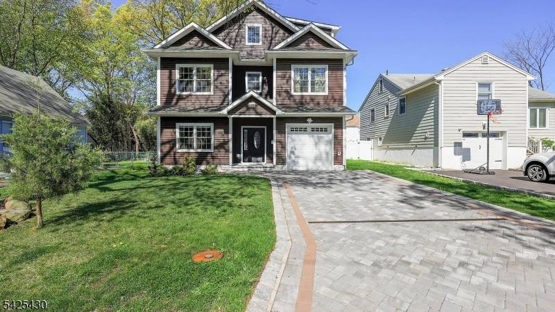 Stunning newer construction 2023 offering modern design, quality craftsmanship, and exceptional functionality, set on a quiet residential street in Cranford.