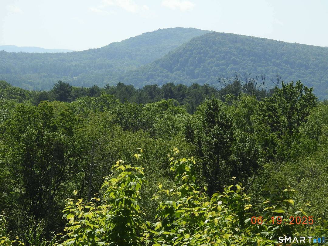 PROPERTY LOCATED VIA A LONG SHARED PRIVATE ROAD.