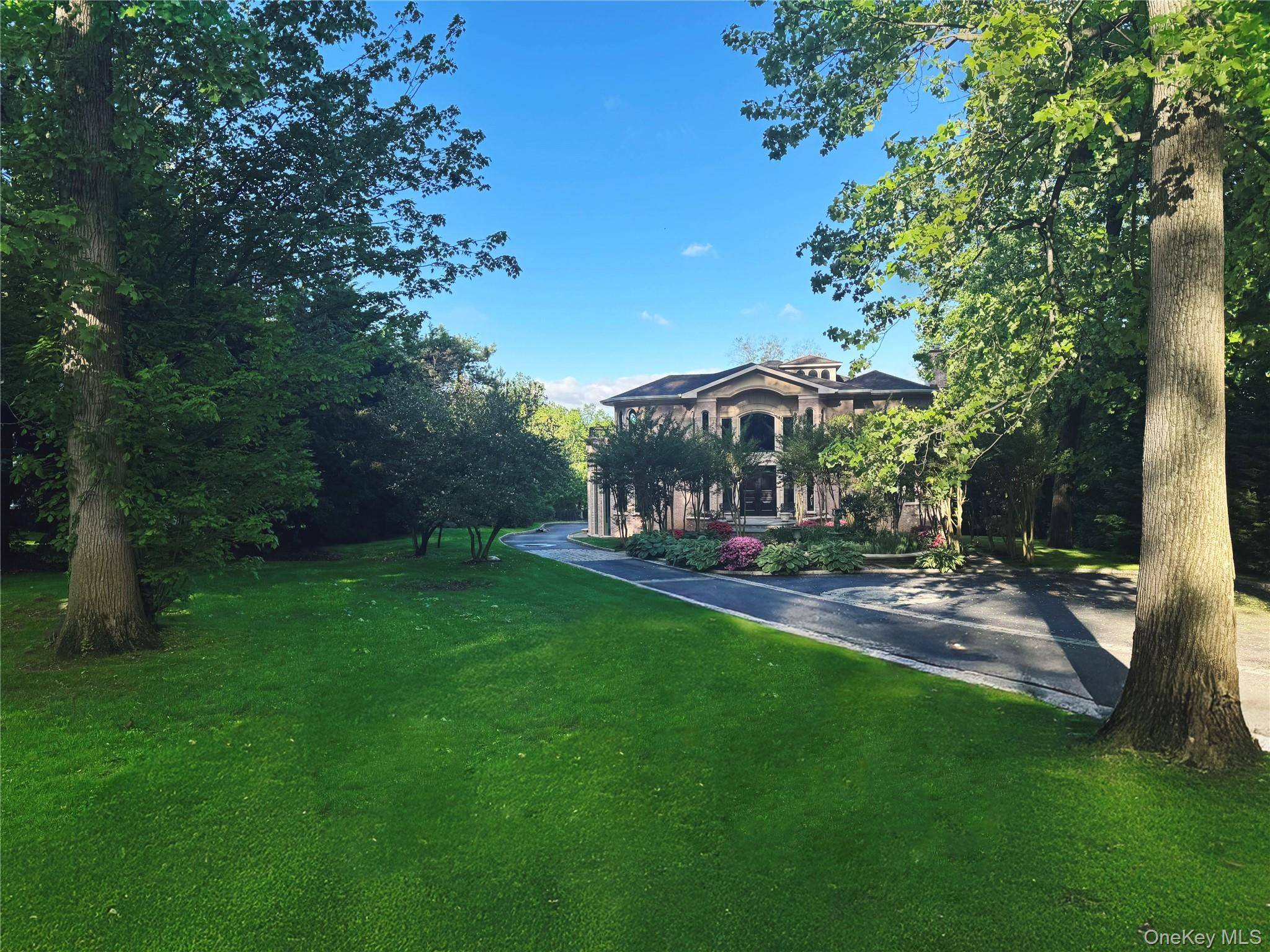 Nestled in the coveted Village of Flower Hill, a stately 2002 built European inspired Contemporary Brick estate effortlessly blends timeless elegance with modern sophistication.