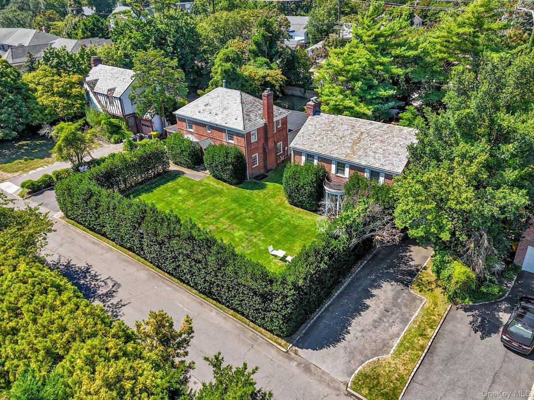 30 Beechwood Drive, Sutton Park, Lawrence, NY This move in ready residence features 6 bedrooms and 4 full bathrooms.