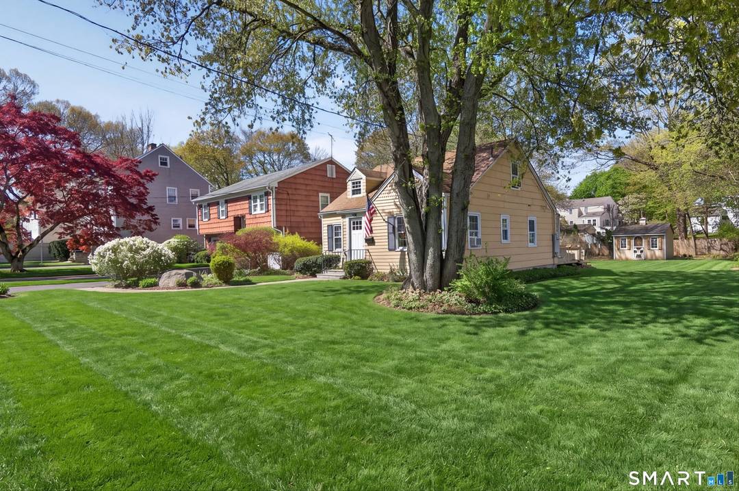 Welcome to 22 Camore Street, a charming move in ready Cape set on a beautiful leveled lot in Stamford.