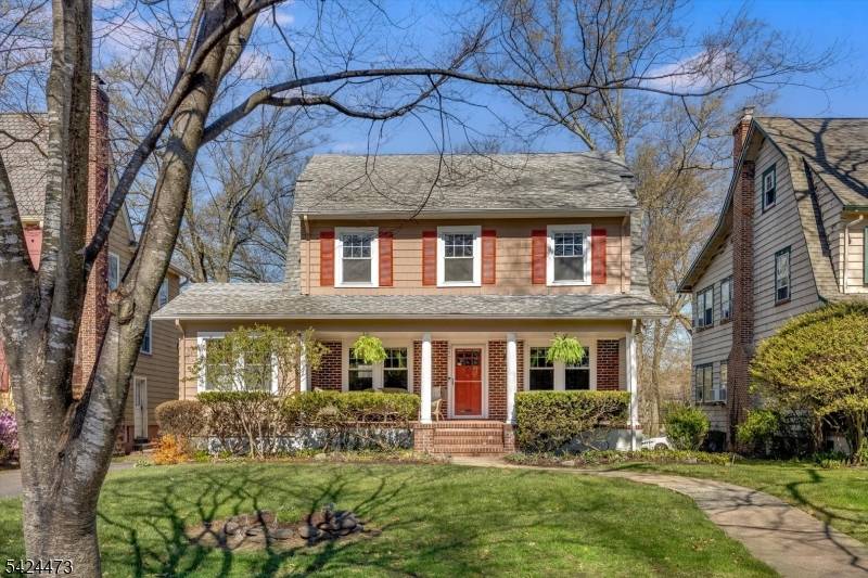Welcome to this classic Center Hall Colonial, ideally situated on a picturesque tree lined street in the highly sought after Village Colonials section.