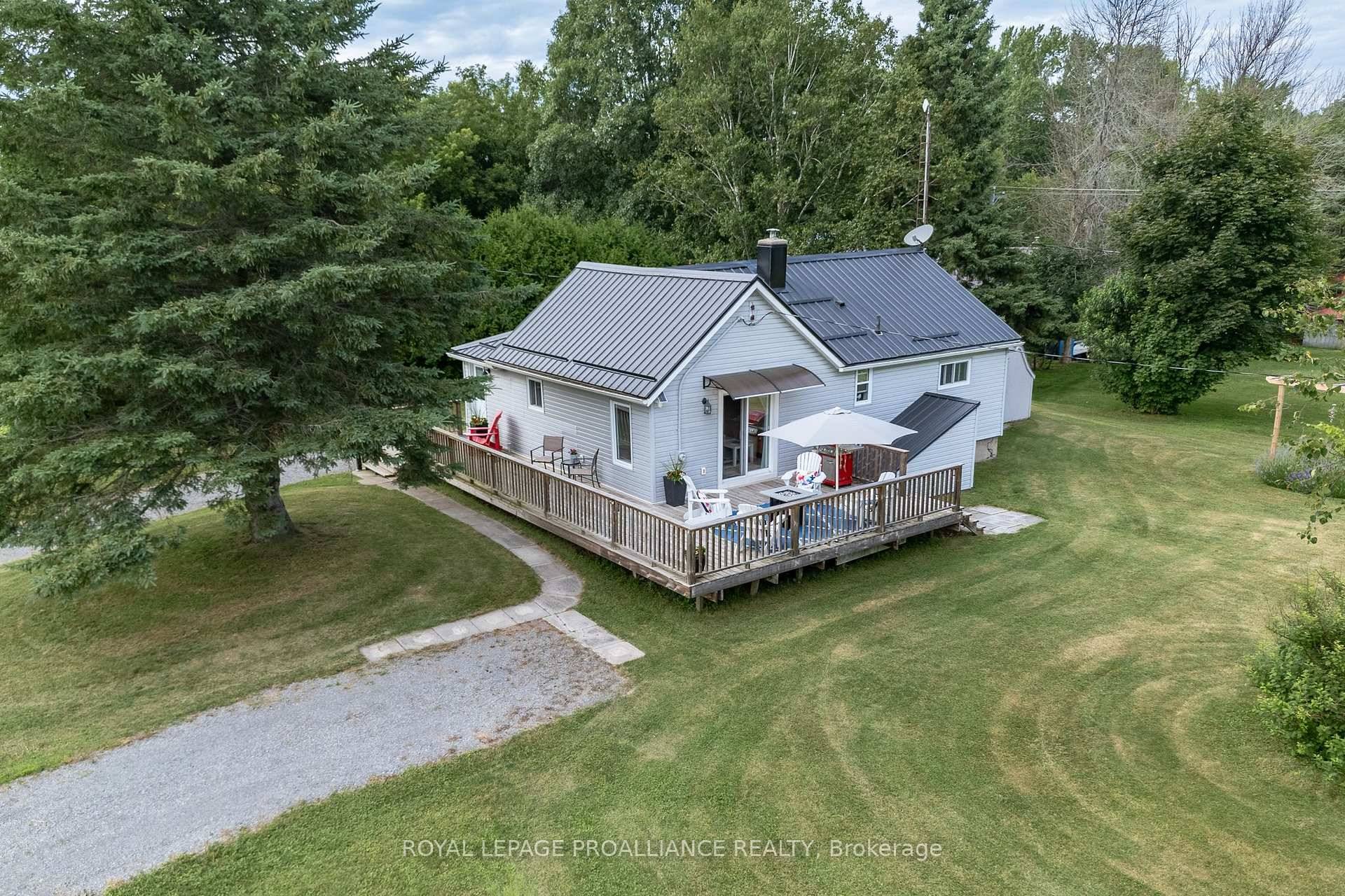 Nestled on a spacious half acre lot, this thoughtfully reimagined 2 bedroom bungalow captures the essence of County living.