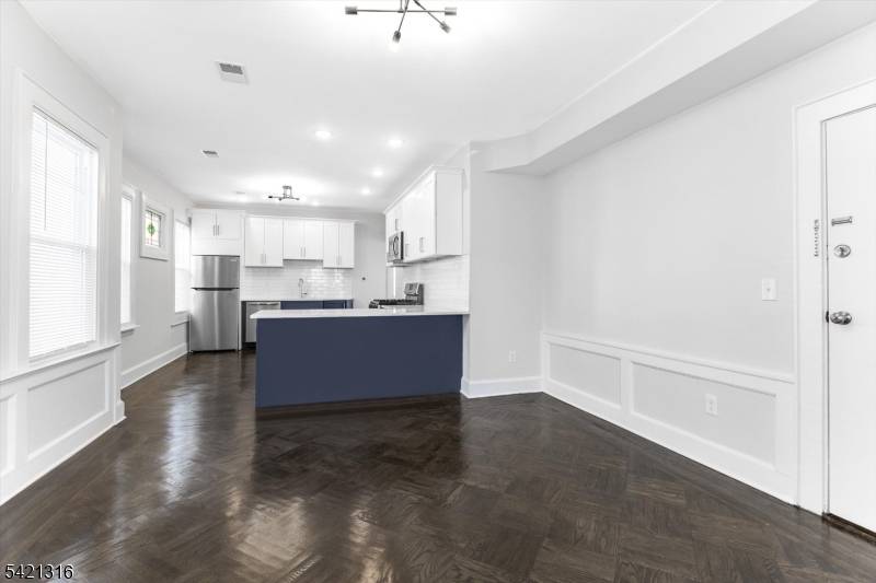 Discover the perfect blend of classic charm and modern convenience with this fully renovated and expansive three family home located in the heart of Bloomfield.