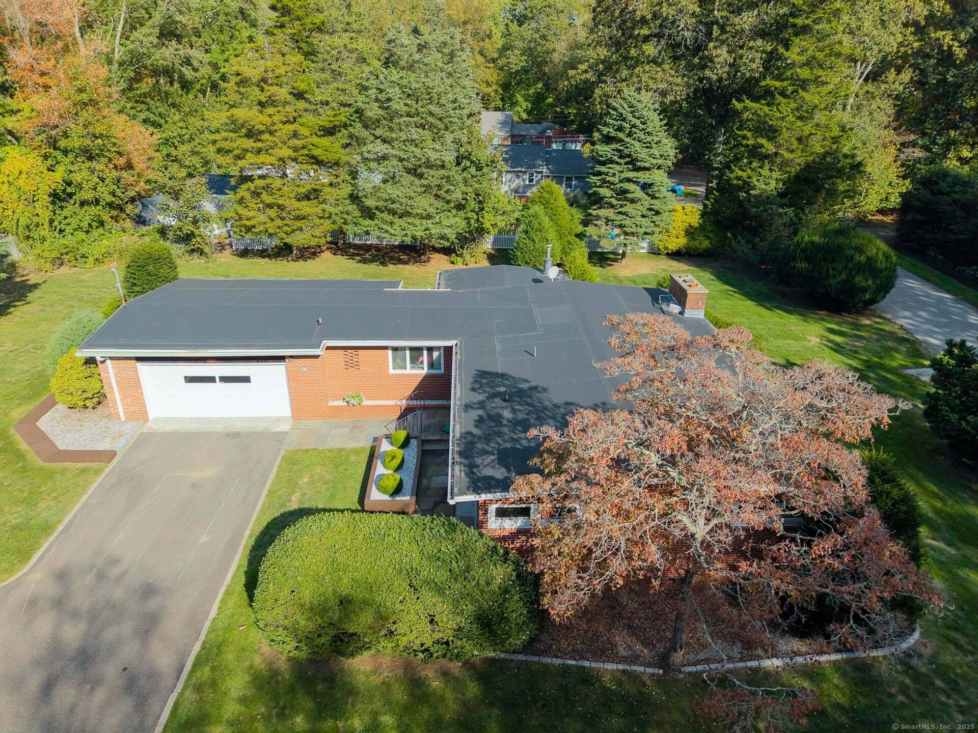 Located on a quiet, tree lined street in Ivoryton, this 1950s gem is a true testament to original mid century modern design.