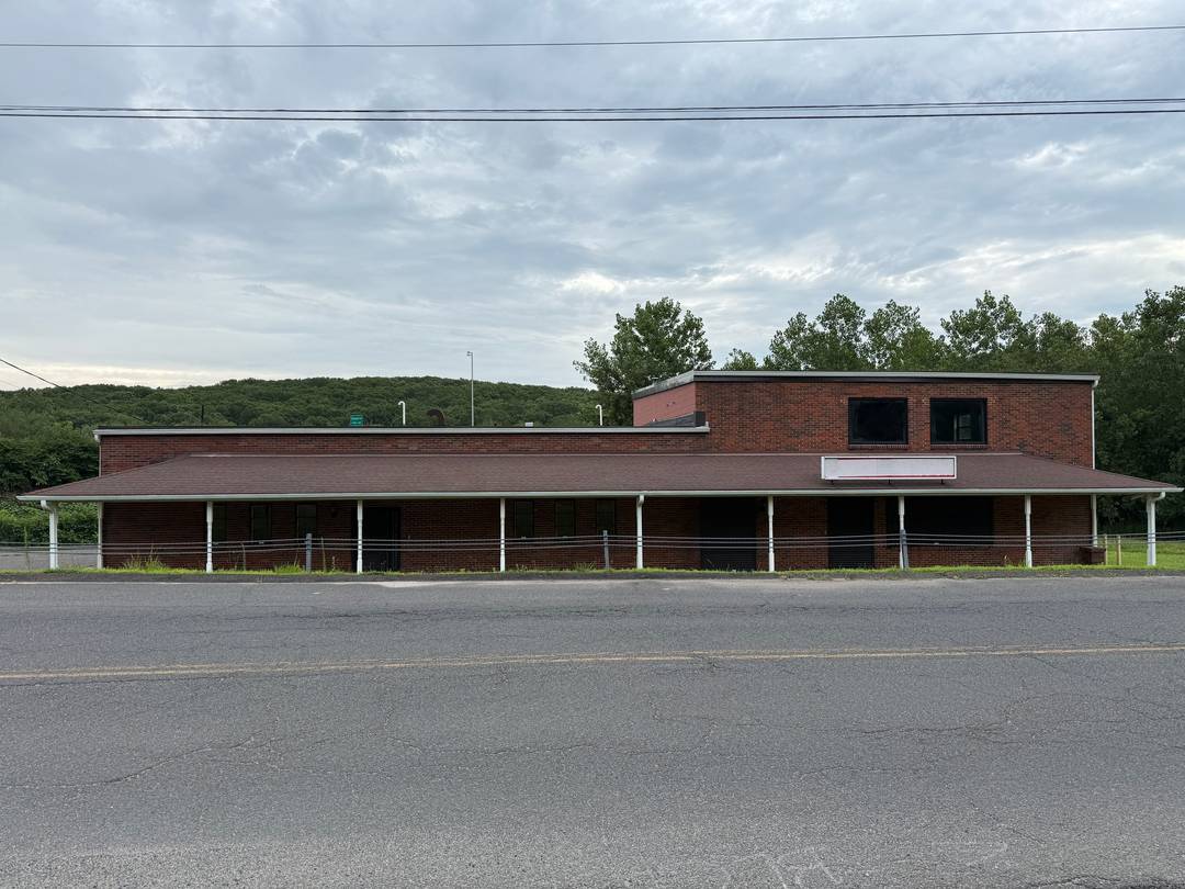 Freshly painted and clean 6, 560sf brick building with ample parking, a loading dock, new roof, windows, security shutters in meticulous condition.
