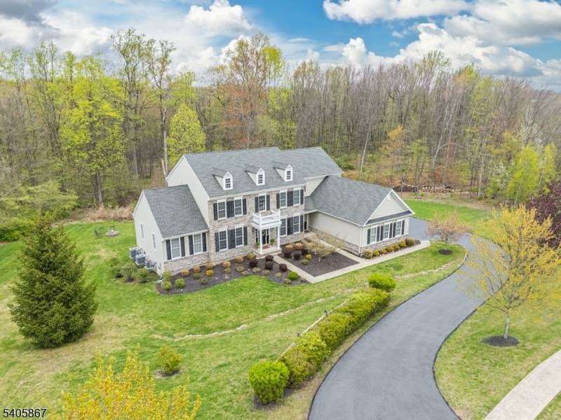 Impressive 5 BR, 4. 1 BA Toll Brothers stone front Colonial in prestigious Morris Hunt in Flanders offers 1.