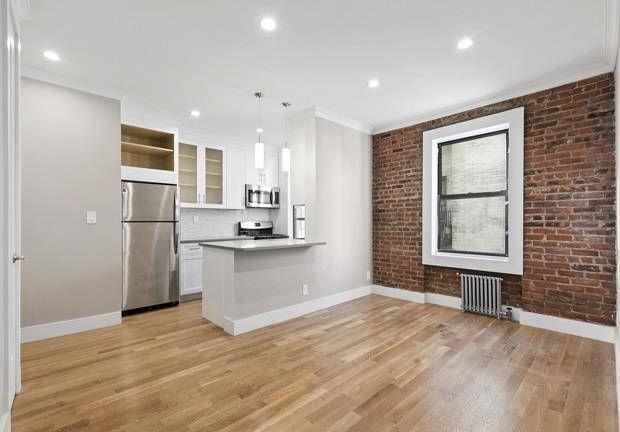 Sponsor Unit. Fantastic Beautifully Gut Renovated home This home features Exposed Brick, Caesar Stone Counter tops.