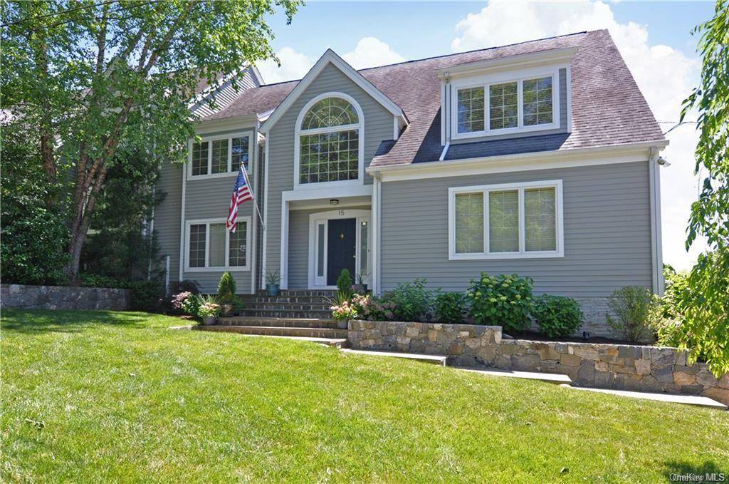 Walk to schools, town and train from this bright and sunny 4 bedroom, 3 bathroom contemporary colonial home located on a private lane.