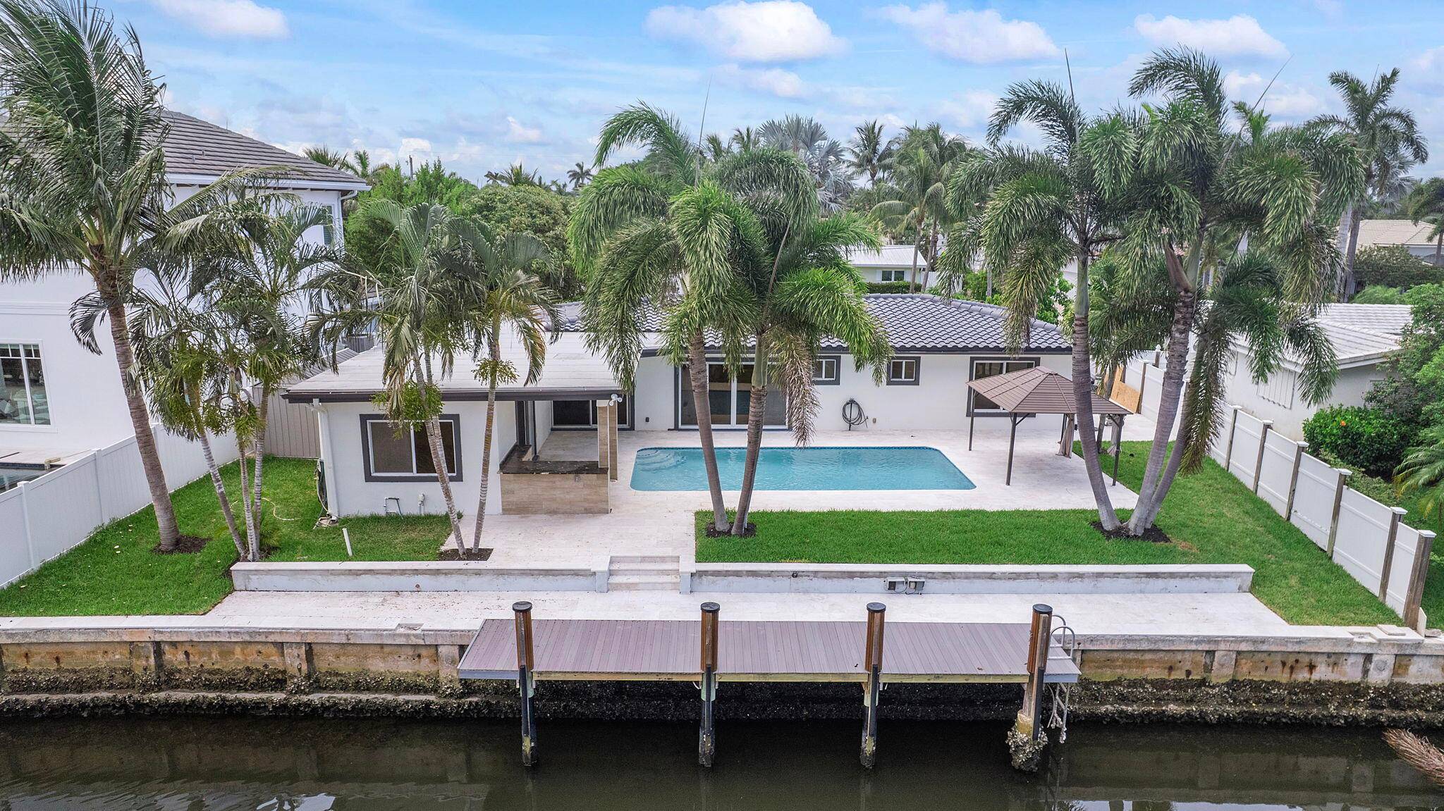 Welcome to a one of a kind, stunning, waterfront, modern tropical oasis.