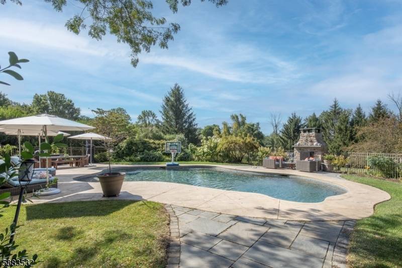 Situated on nearly 2 picturesque acres in Chester's prestigious Hedgerows neighborhood, this impressive colonial blends authentic architecture with enduring appeal.
