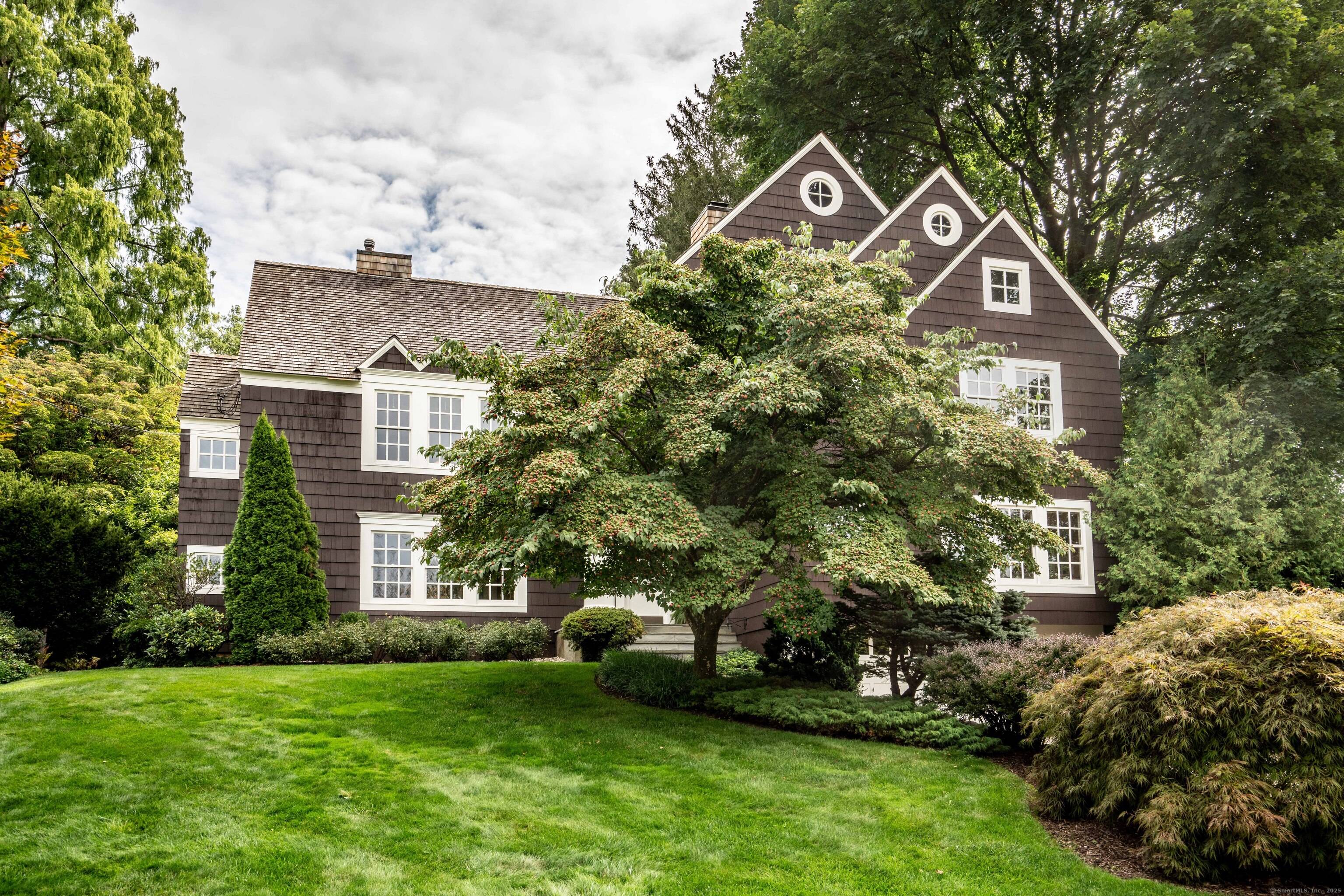 Stunning Architect Designed Shingle Style Home in Hartford Golf Club Neighborhood This award winning 5 bedroom, 2 full and 2 half bath home offers timeless elegance and exceptional craftsmanship.