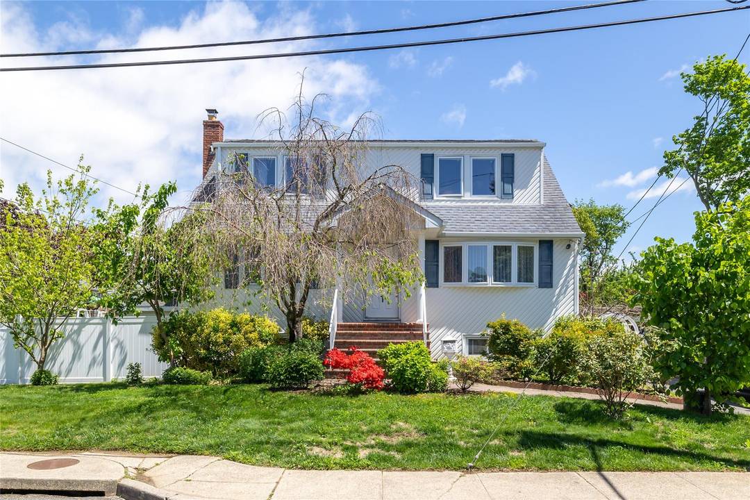 Discover This Beautifully Maintained and Updated Expanded Cape With 4 Bedrooms And 4 Full Bathrooms.