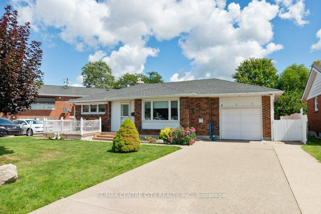 Charming brick bungalow with attached garage, located close to hospital.