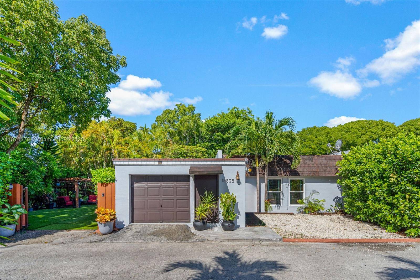 Welcome to your private oasis in the highly sought after Country Club of Miami !