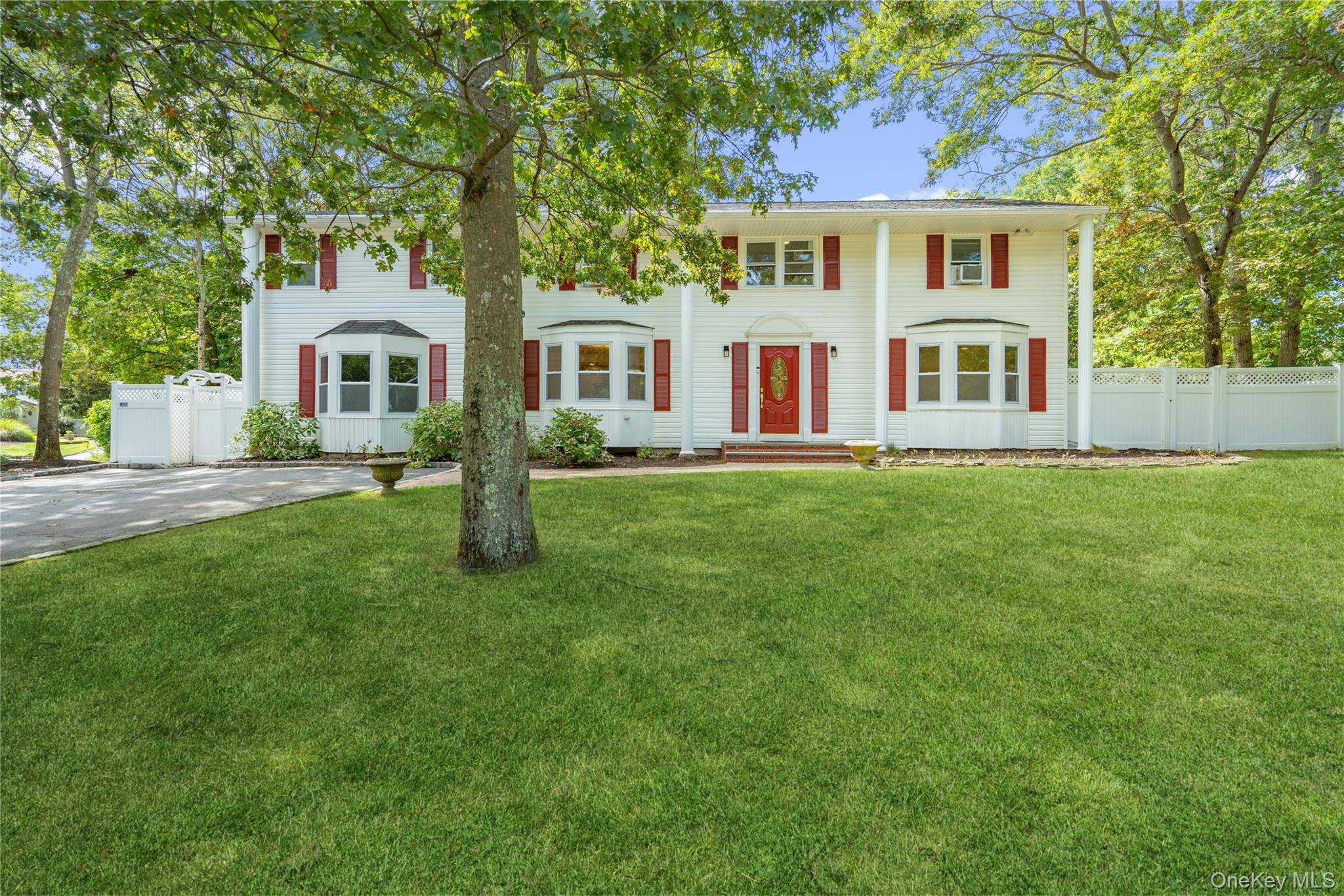 This center hall colonial in the Mount Sinai school district has it all.