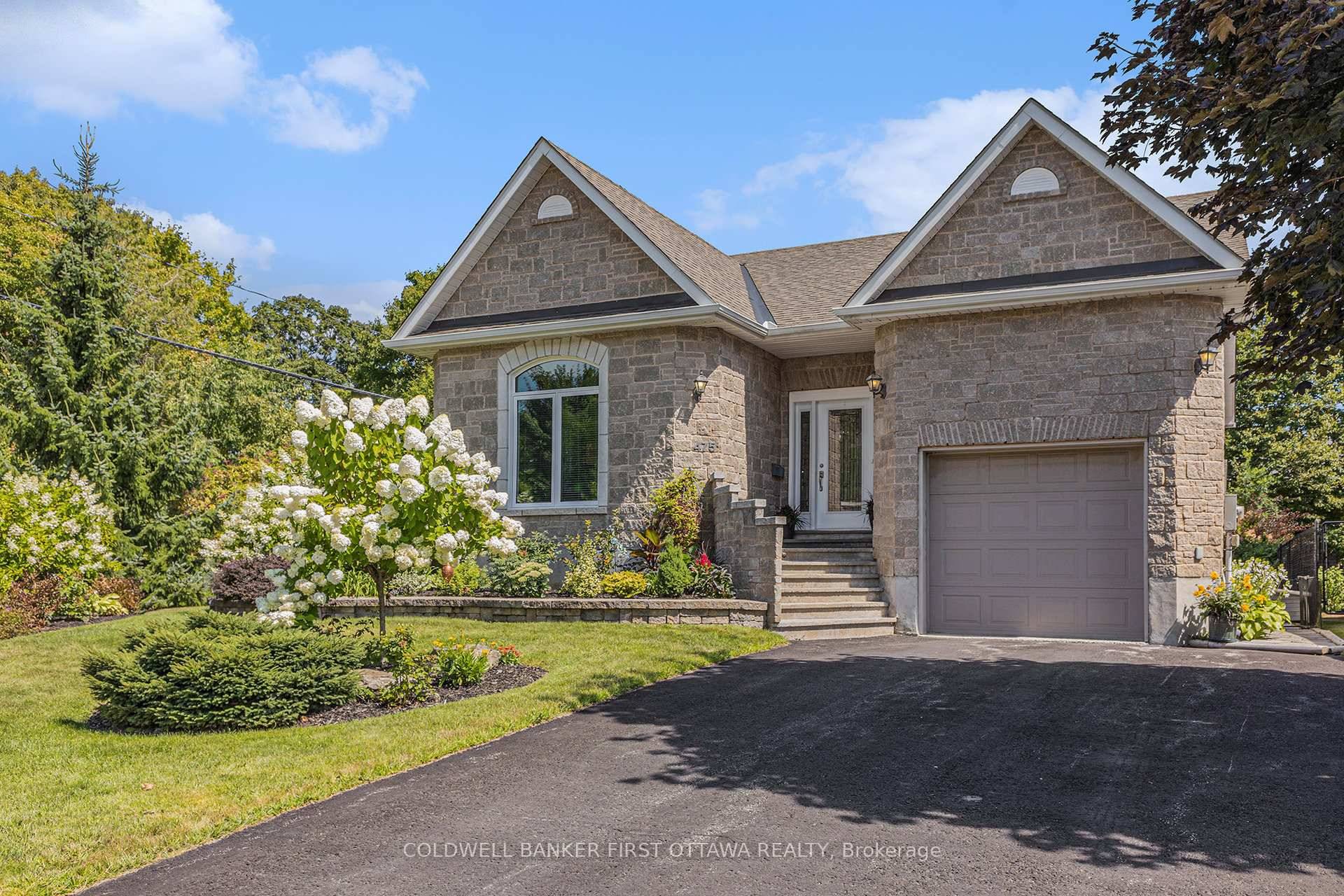 Well appointed stone faced bungalow has much to offer.