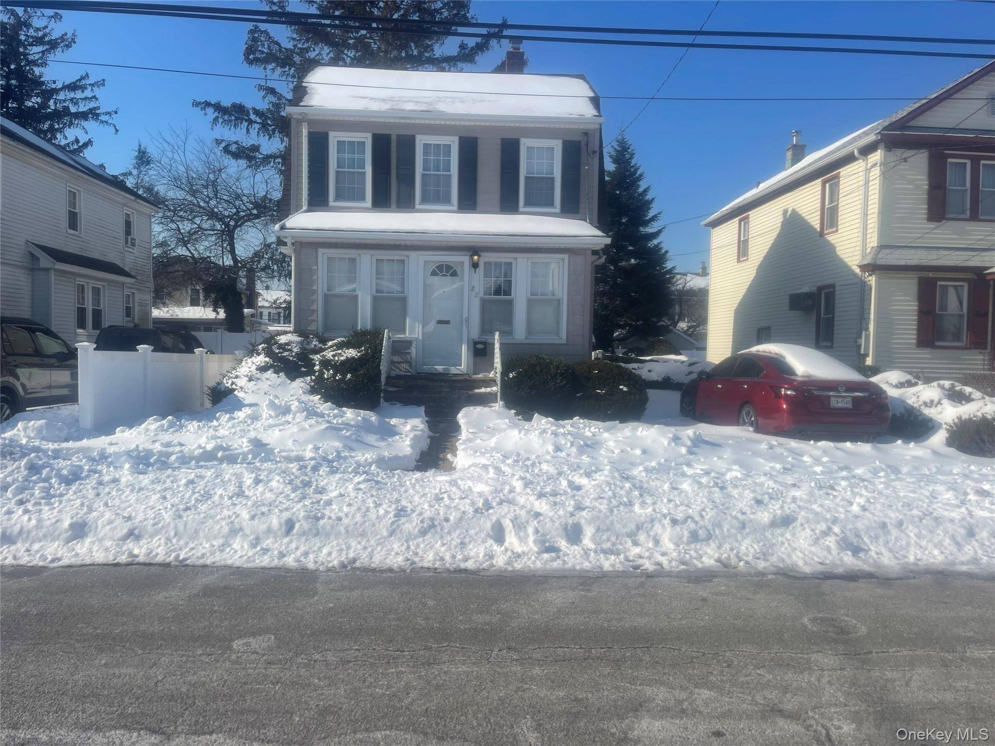 THREE BEDROOM ONE BATH SIDE HALL COLONIAL WITH PARQUET FLOORS AND CARPET.