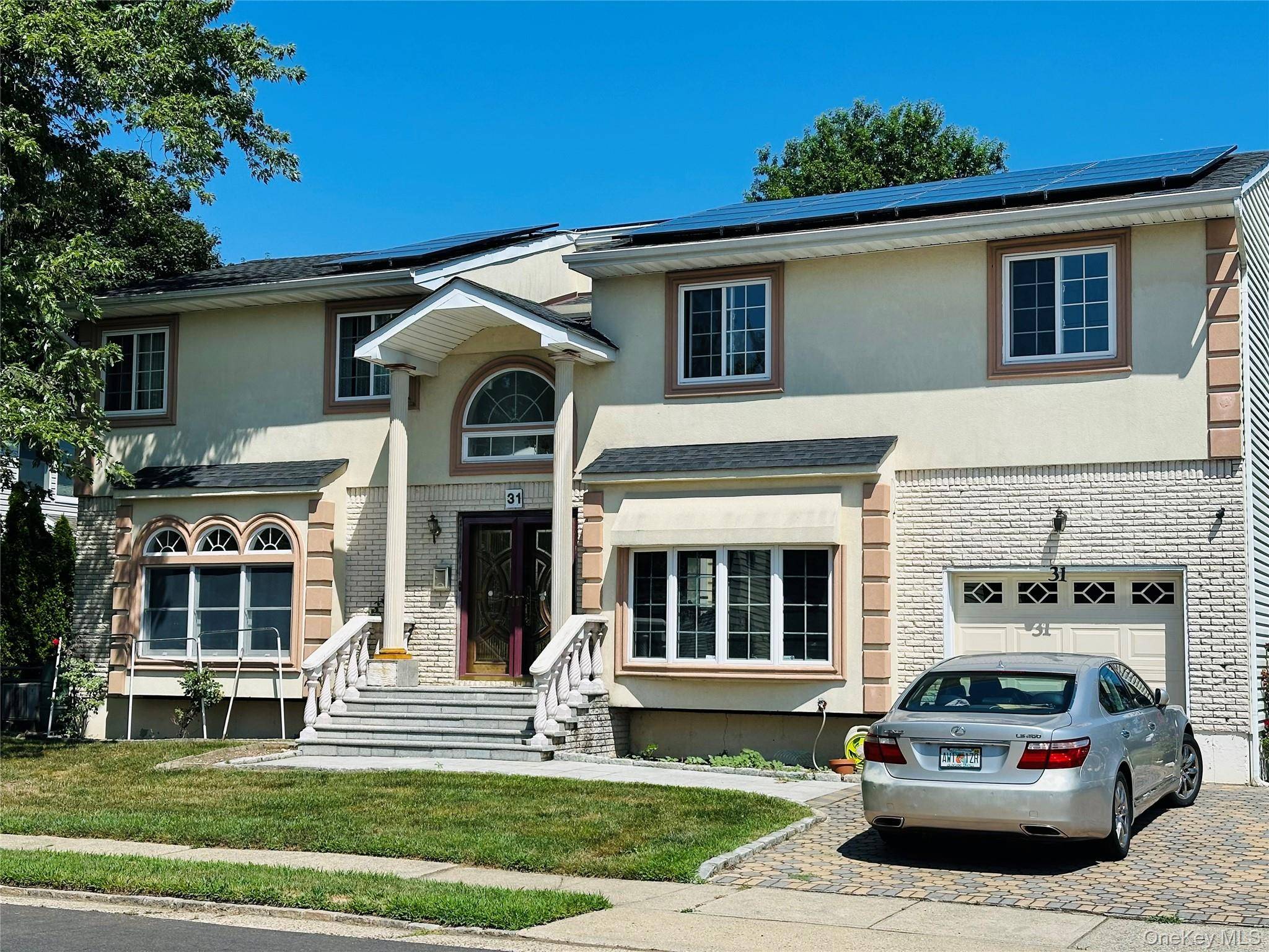 IMPRESSIVE MODERN 4 BEDROOM COLONIAL PRIVATELY LOCATED ON ONE THE NICEST BLOCK IN ROSLYN HEIGHTS.