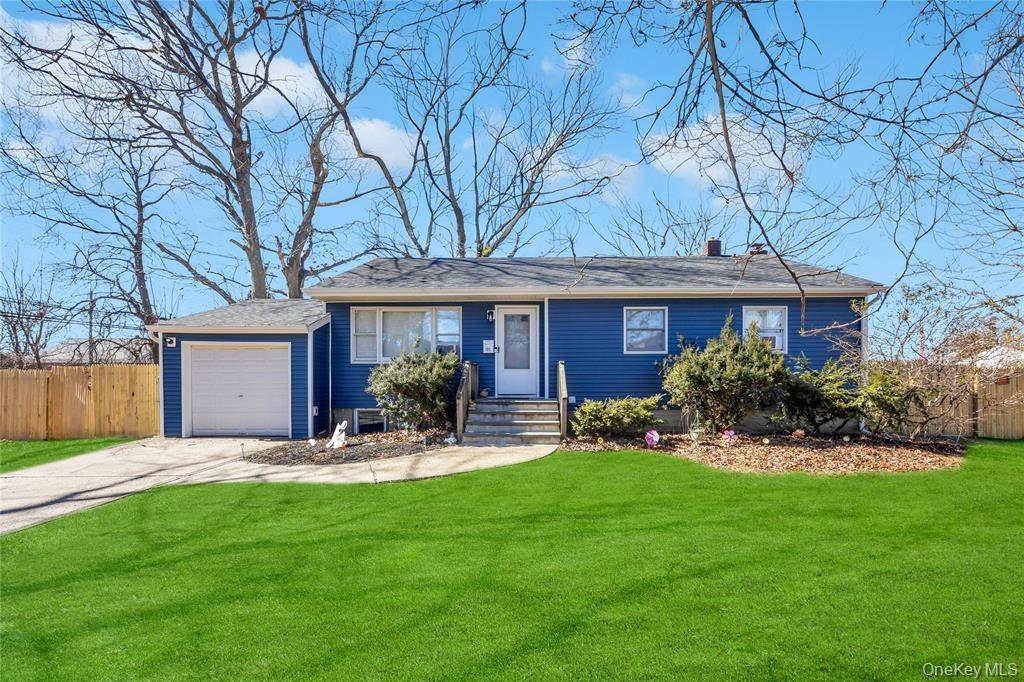 Welcome home to 131 Eastwood Blvd in Centereach.