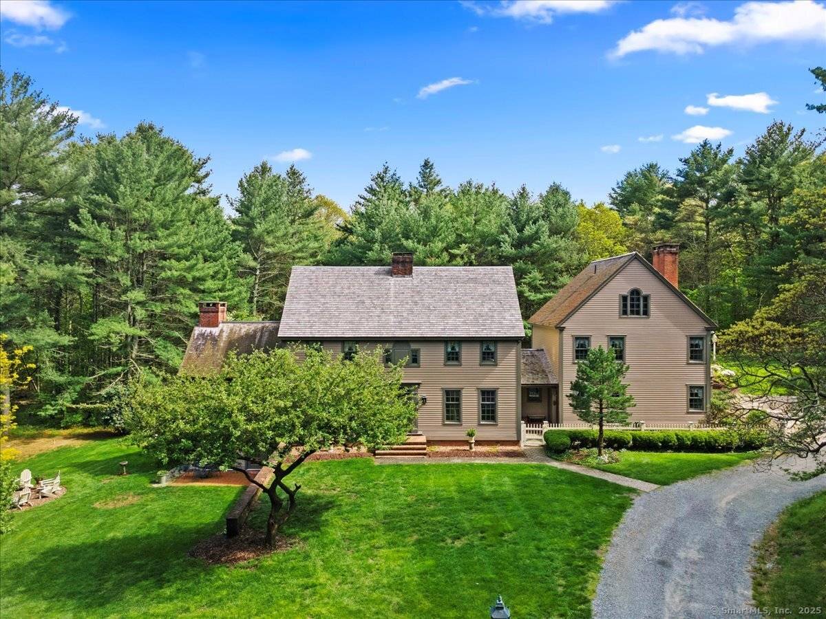 Embrace the grandeur of New England charm with this exquisite Colonial home, boasting 5 bedrooms, 4 full and 1 half baths, nestled in a truly idyllic park like setting.