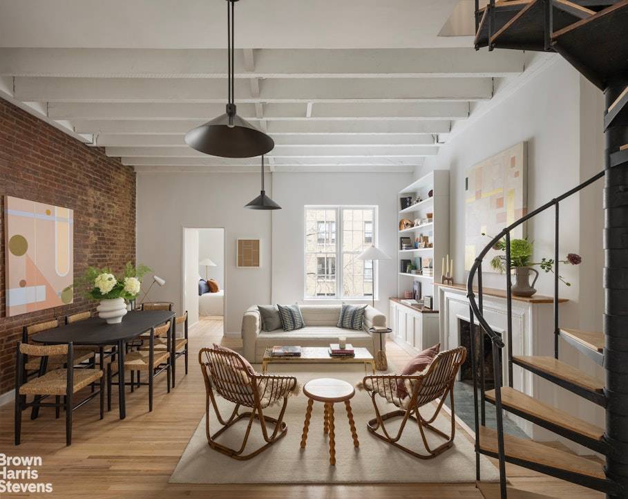 IMMACULATELY RENOVATED, sun drenched duplex with PRIVATE TERRACE, WOOD BURNING FIREPLACE and IN UNIT WASHER DRYER.