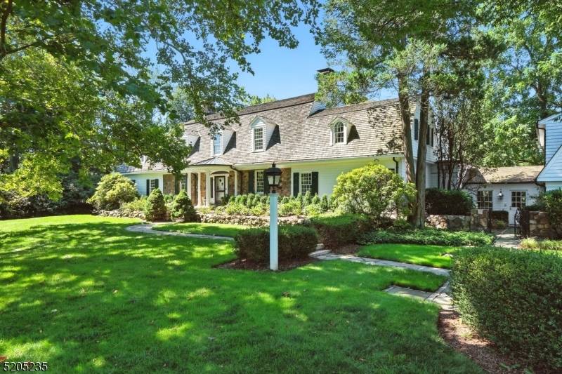 OLD STONE COTTAGE A MAGNIFICENT SHORT HILLS ESTATE Set atop 1.
