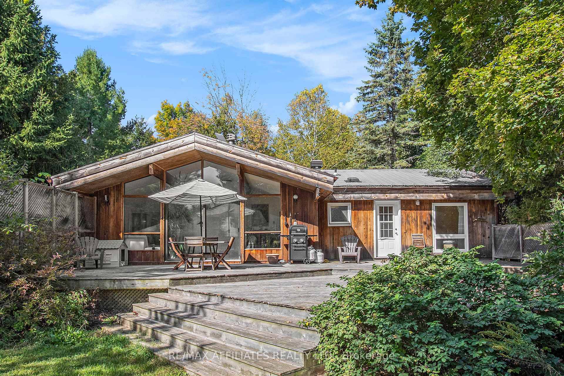 Discover your perfect retreat on 2 acres along the peaceful Rideau River, just minutes from Merrickville.