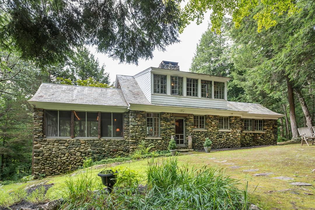 Located on a hill overlooking the main house of this 14 ACRE compound on a designated Scenic Road, this 2BR 1B 1929 solid stone cottage is just 60 M from ...