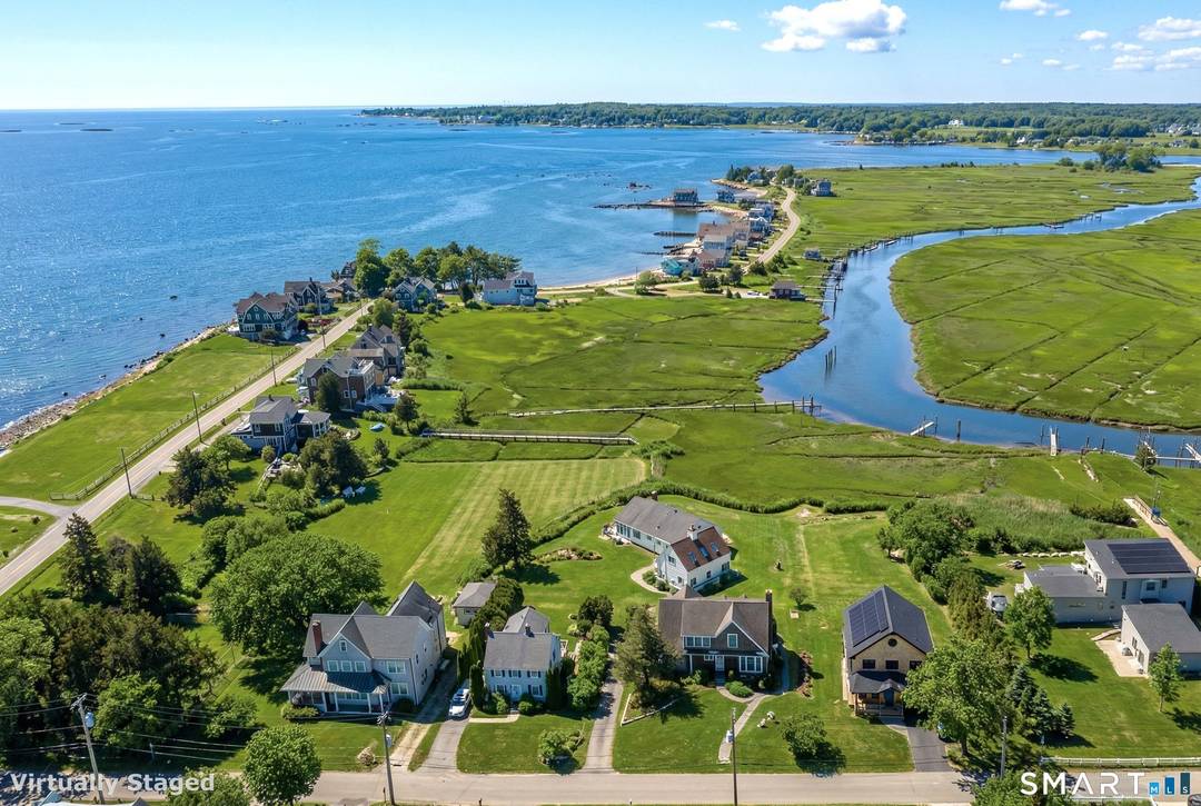 Perched high above the flood plains, this pristine coastal retreat captures sweeping views of the Neck River as it opens into the Long Island Sound.