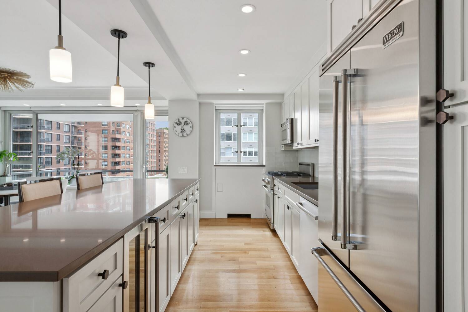 Welcome to Apartment E1005 at The Manhattan House, a sun filled corner two bedroom, two bathroom residence spanning over 1, 500 square feet with coveted east and south exposures and ...